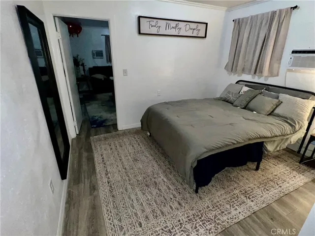a bedroom with a bed and walk in closet