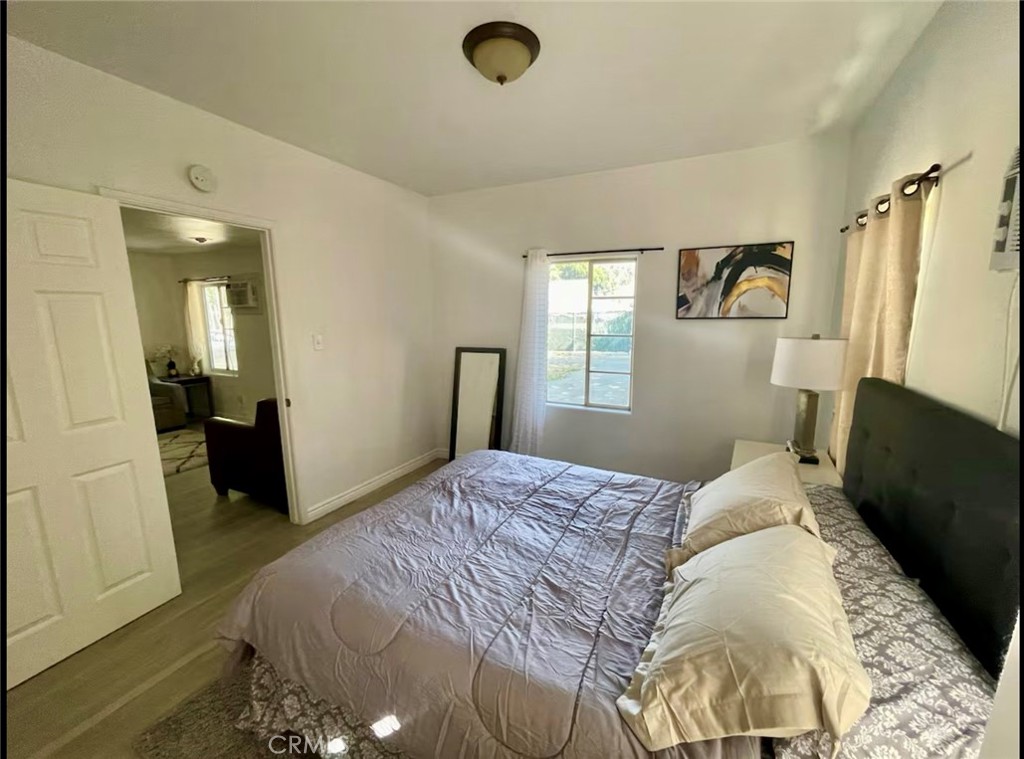 10945-10953 Campbell Avenue Riverside, CA 92505 - Photo 7 of 34 a bedroom with a bed and a window