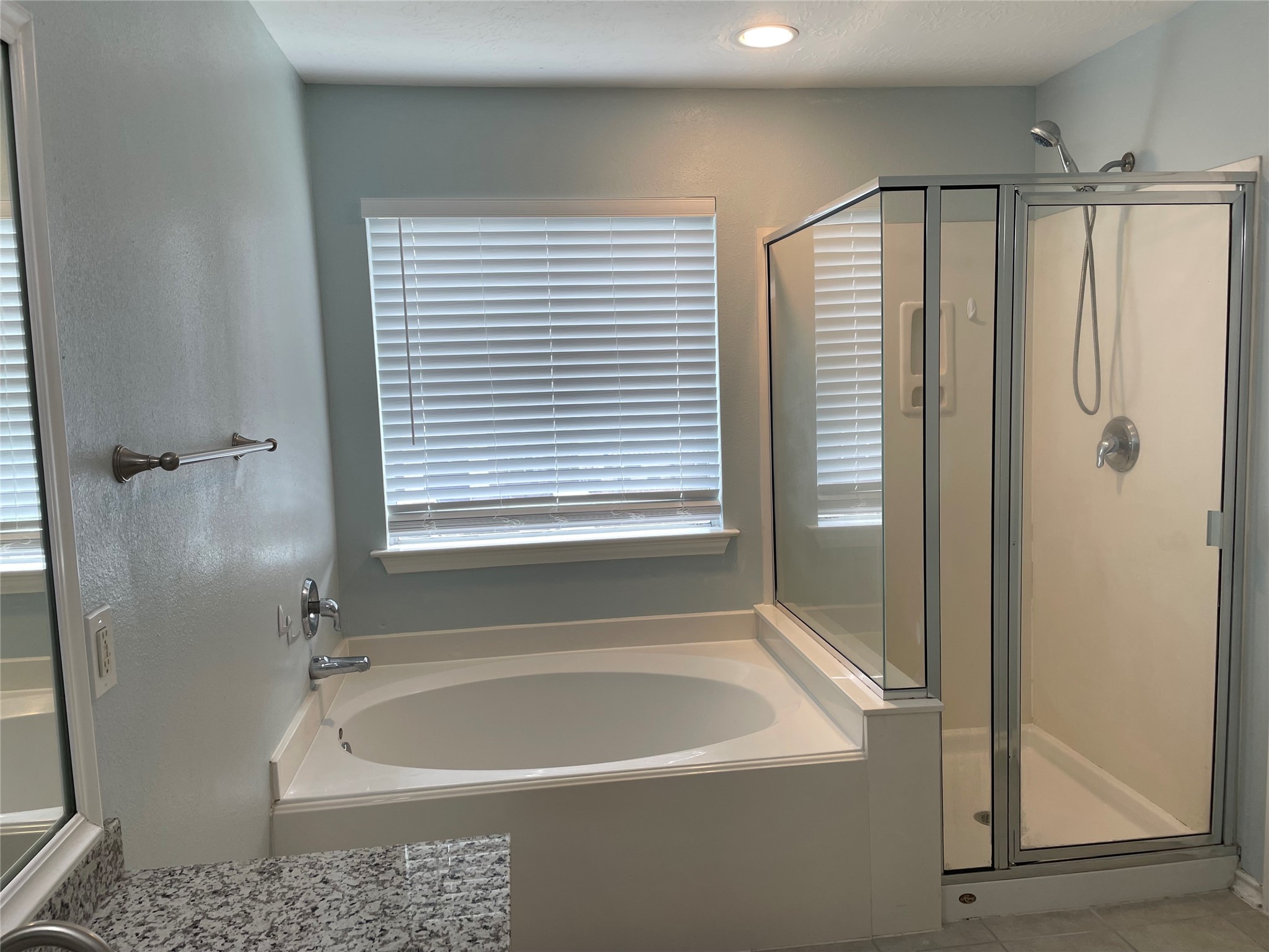 9022 Elm Drake Lane Humble, TX 77338 - Photo 13 of 17 a white bath tub sitting next to a shower