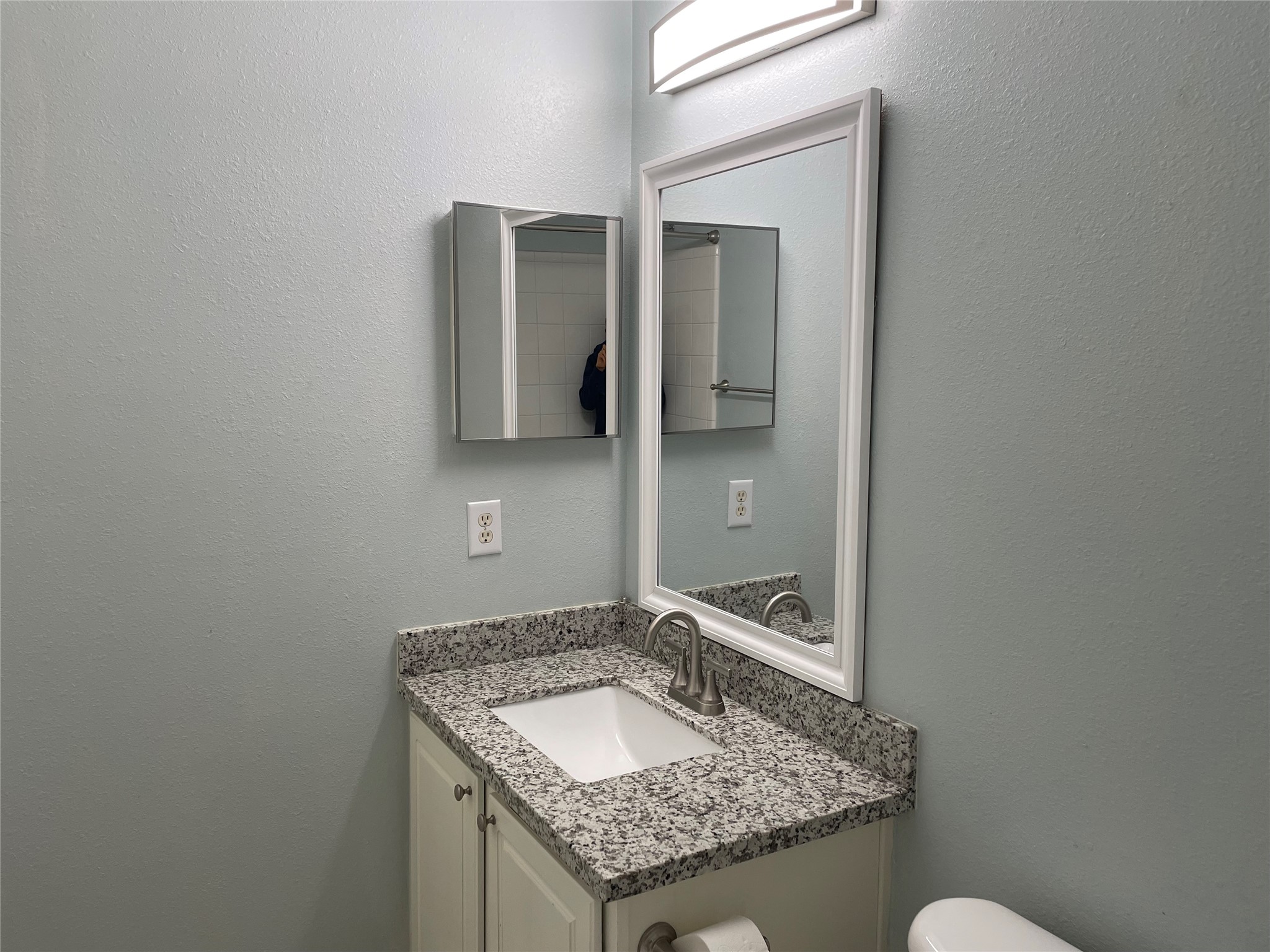 9022 Elm Drake Lane Humble, TX 77338 - Photo 16 of 17 a bathroom with a granite countertop sink and a mirror