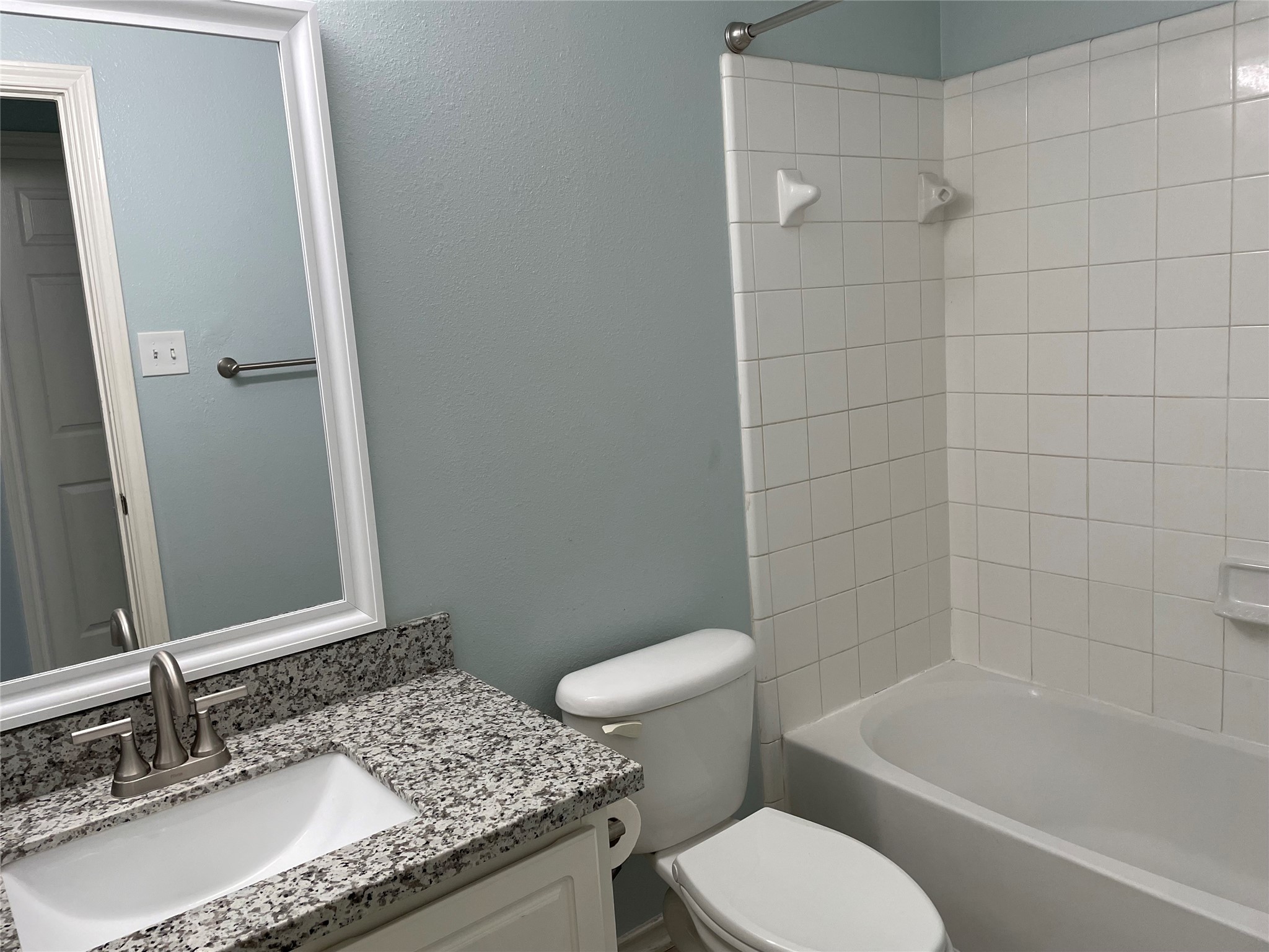 9022 Elm Drake Lane Humble, TX 77338 - Photo 17 of 17 a bathroom with a granite countertop sink toilet and shower