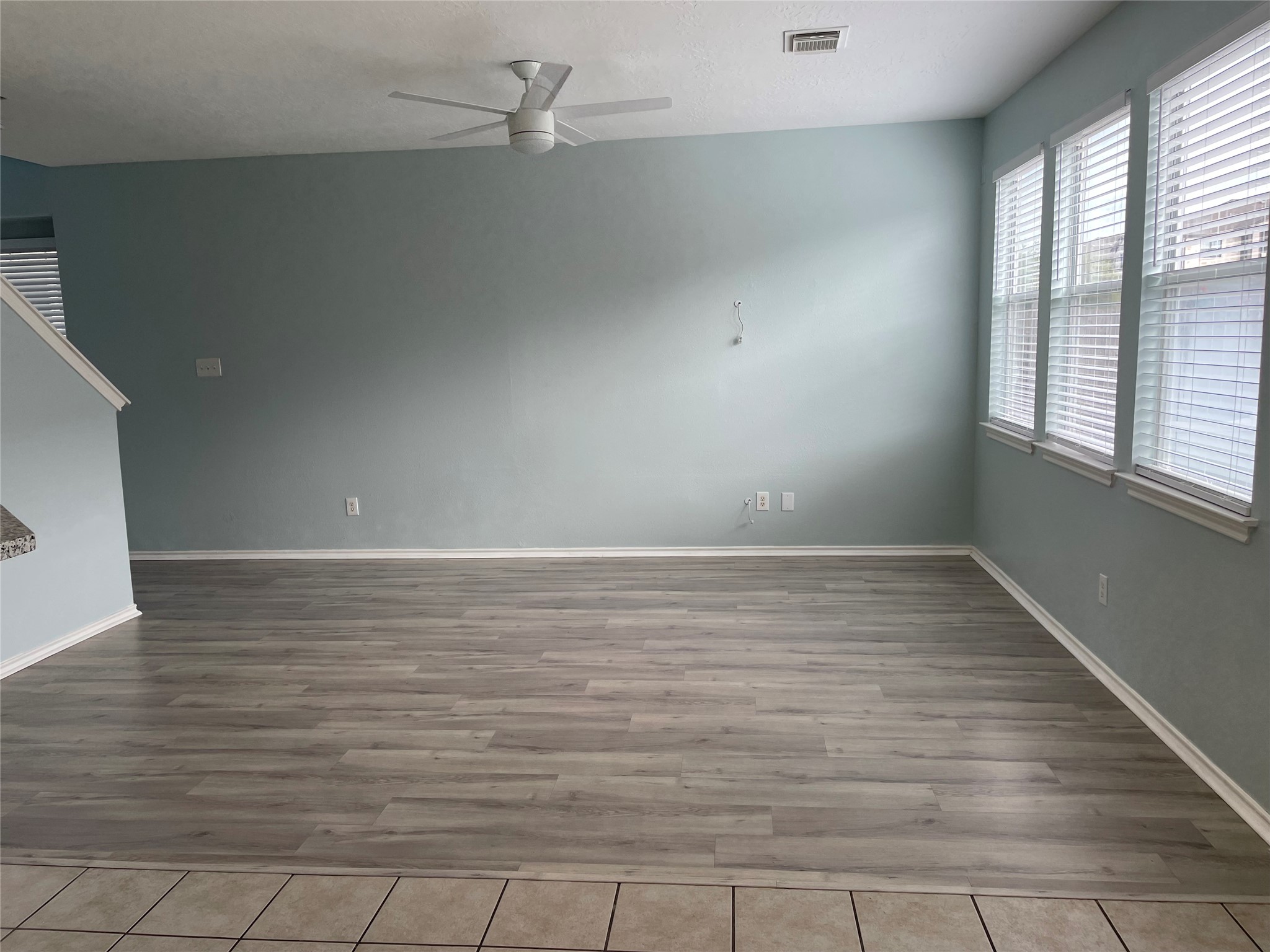 9022 Elm Drake Lane Humble, TX 77338 - Photo 2 of 17 wooden floor in an empty room with a window