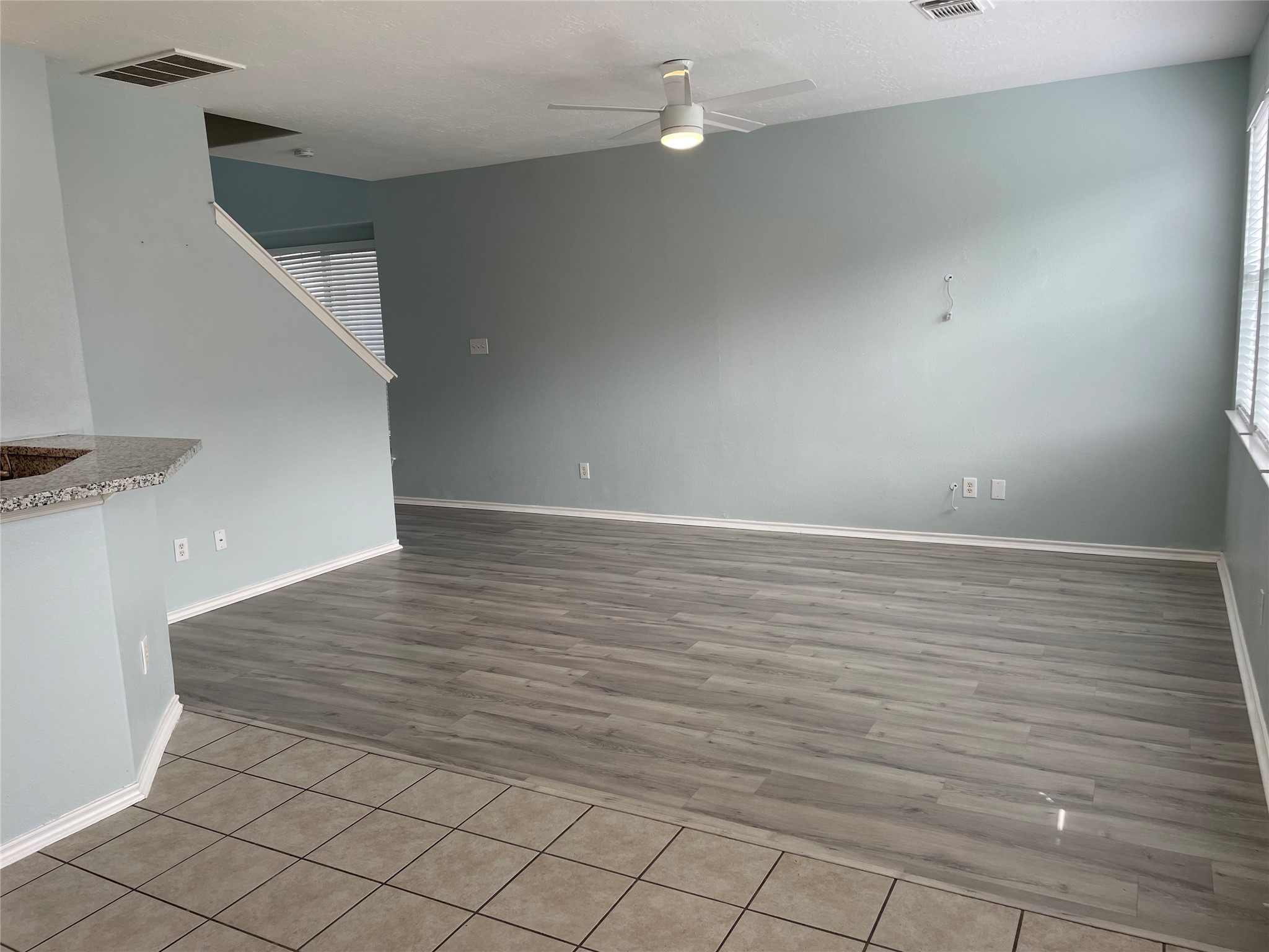 9022 Elm Drake Lane Humble, TX 77338 - Photo 4 of 17 a view of an empty room with wooden floor