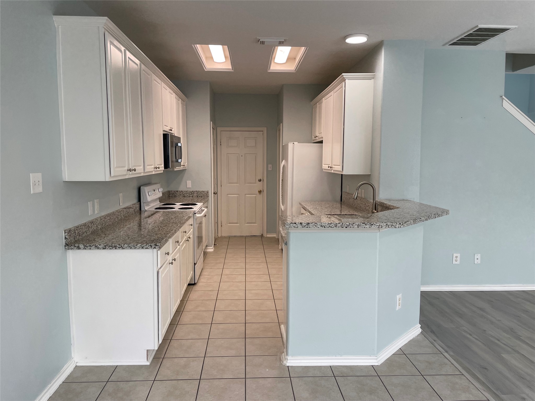 9022 Elm Drake Lane Humble, TX 77338 - Photo 6 of 17 a kitchen with stainless steel appliances granite countertop a sink and a stove