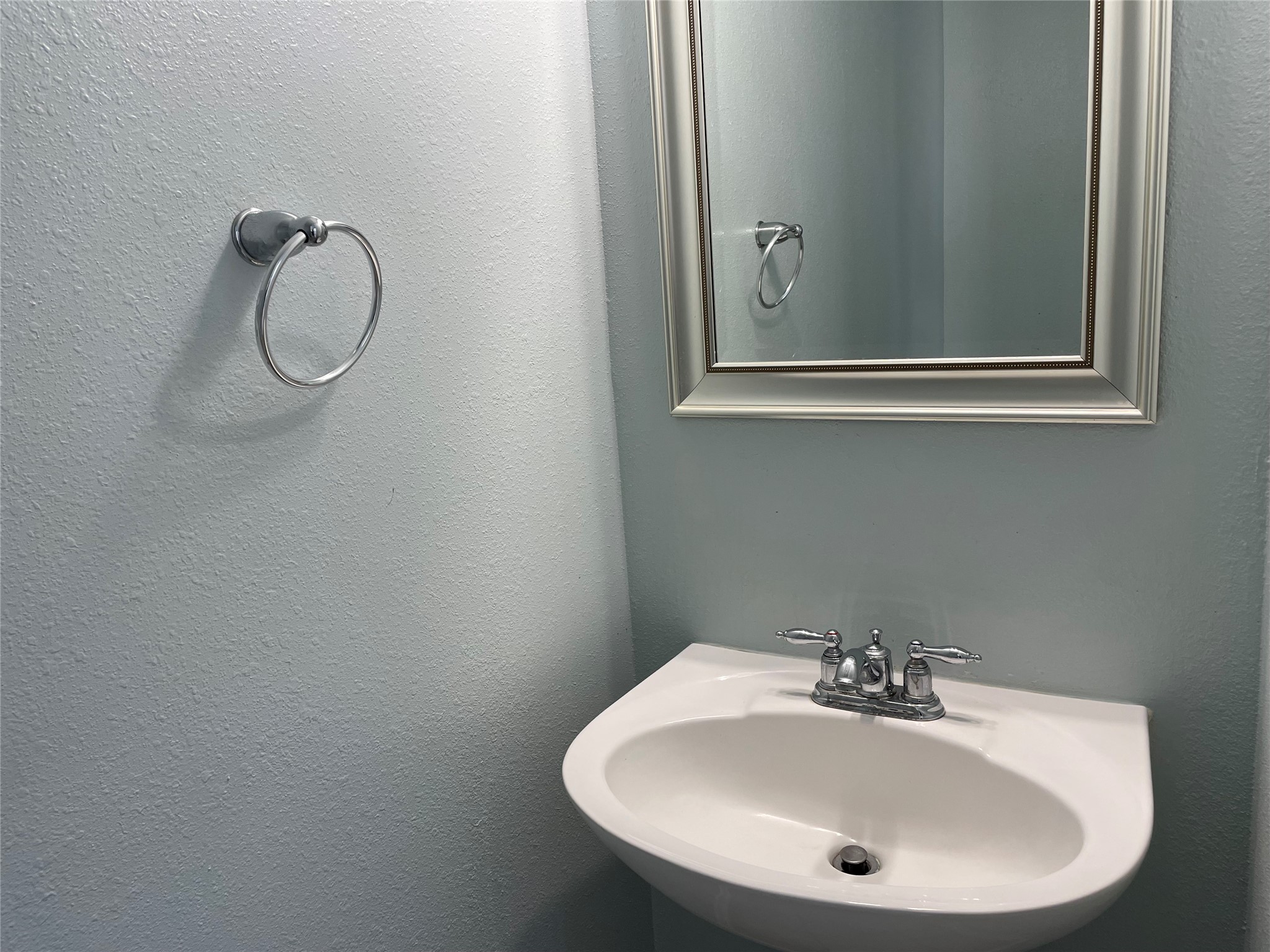 9022 Elm Drake Lane Humble, TX 77338 - Photo 8 of 17 a bathroom with a sink and a mirror