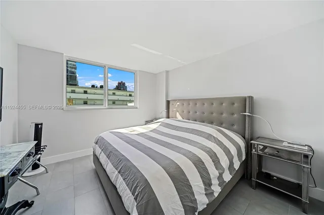 a living room with furniture and a lamp