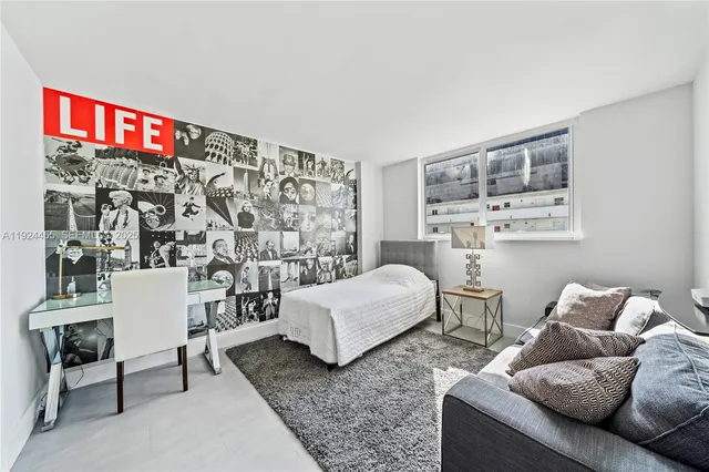 a bedroom with a large bed and a closet