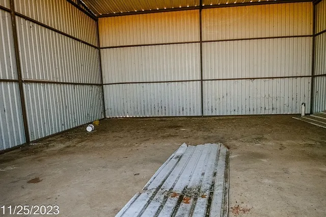 an empty room with a ceiling fan
