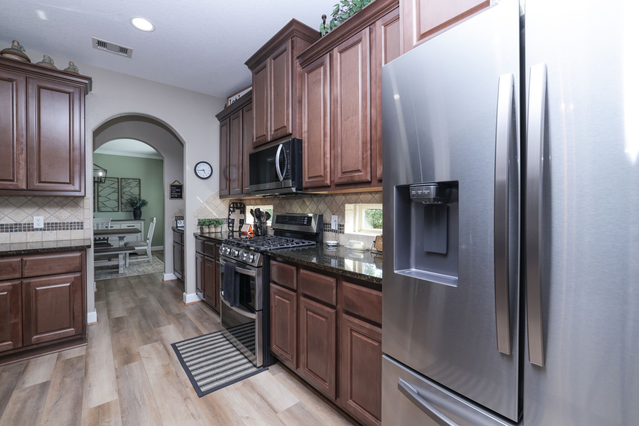 5922 Glen Lief Court Spring, TX 77379 - Photo 15 of 41 a kitchen with stainless steel appliances granite countertop a refrigerator and a stove top oven
