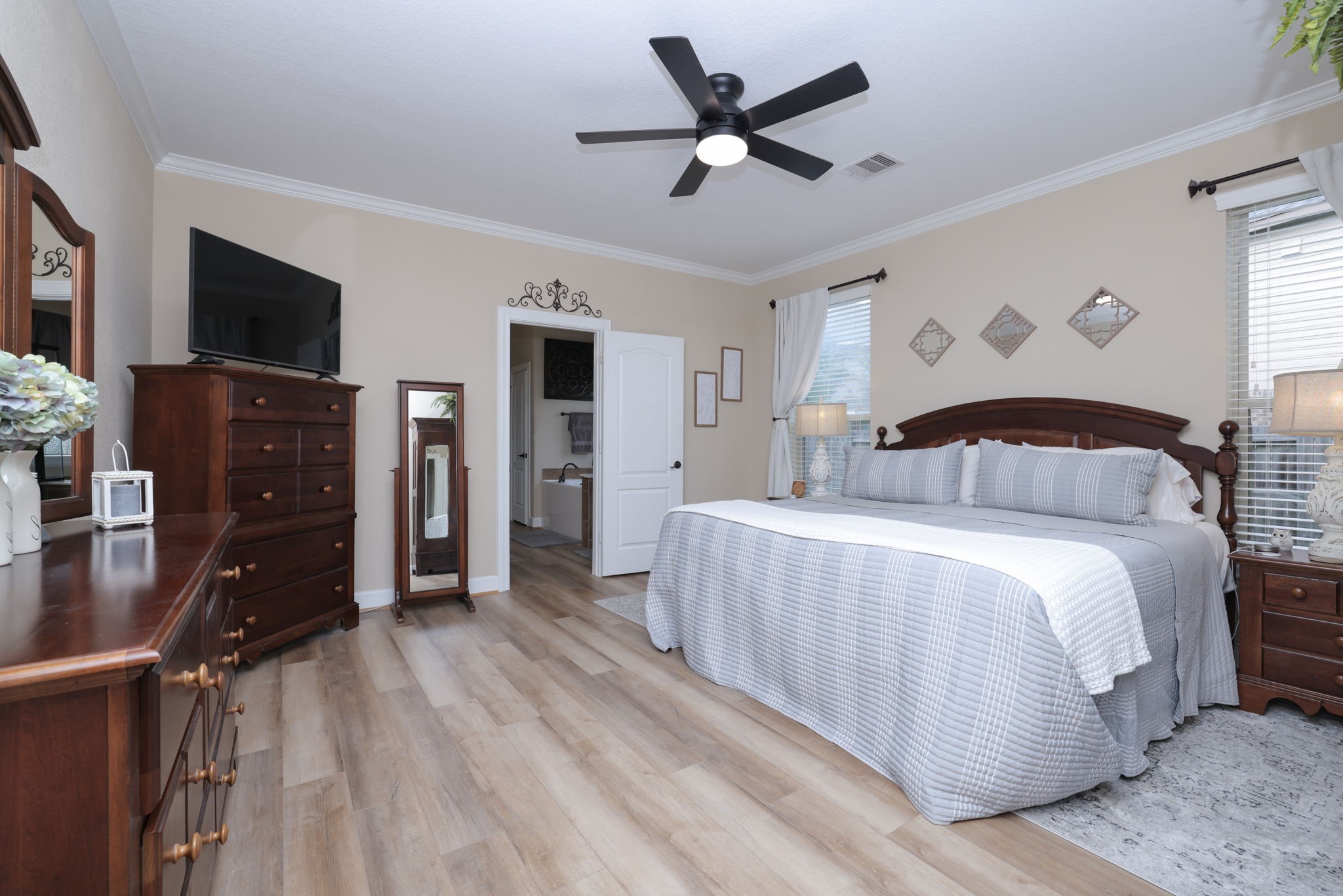 5922 Glen Lief Court Spring, TX 77379 - Photo 19 of 41 a bedroom with a bed and a tv on the dresser