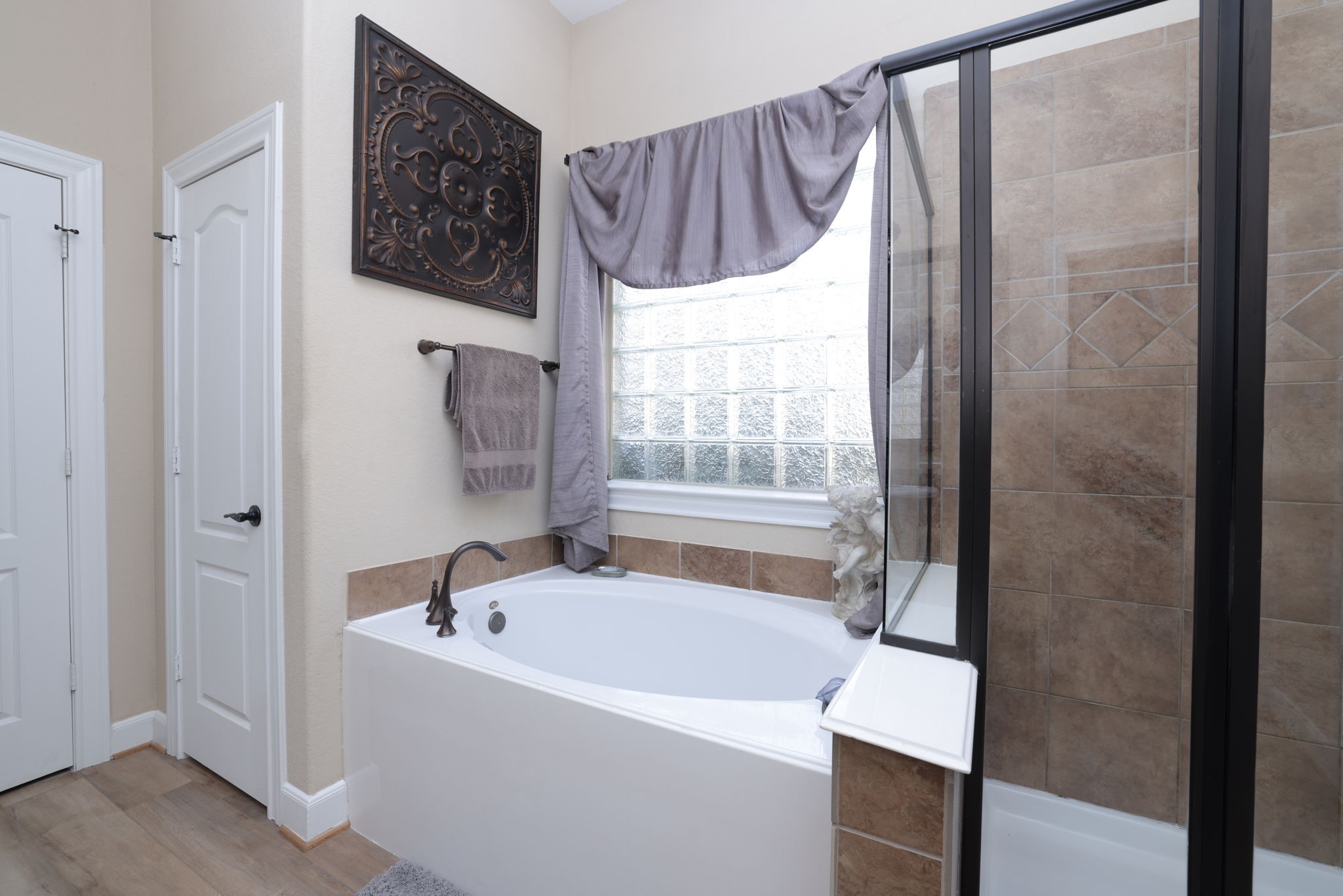5922 Glen Lief Court Spring, TX 77379 - Photo 24 of 41 a bathroom with a bathtub and a shower