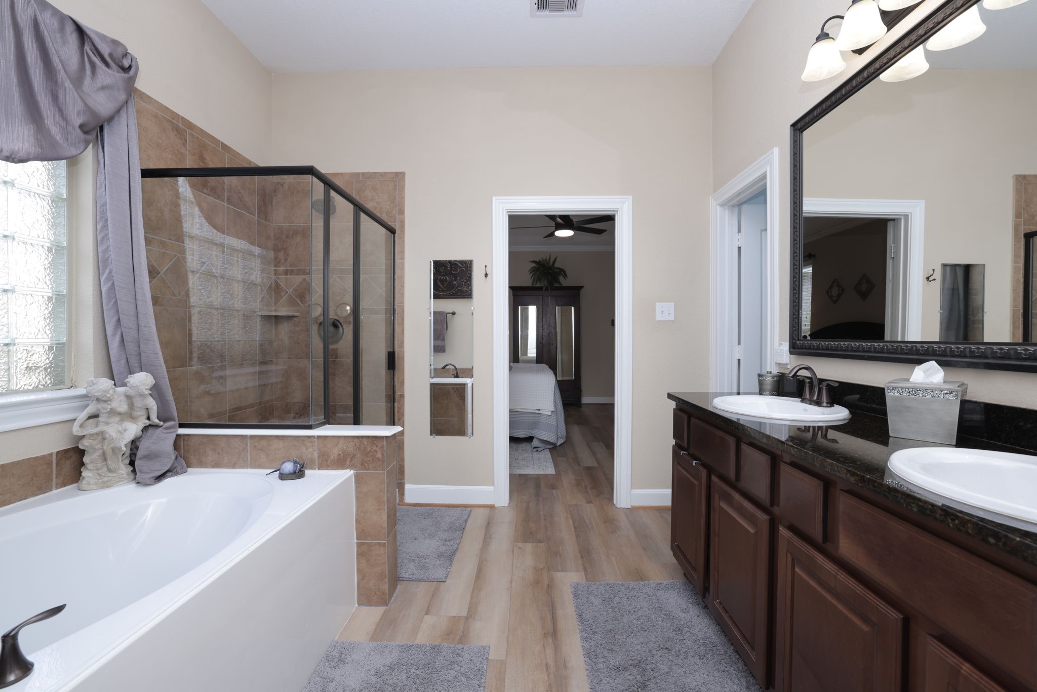 5922 Glen Lief Court Spring, TX 77379 - Photo 26 of 41 a bathroom with a tub a sink and a large mirror