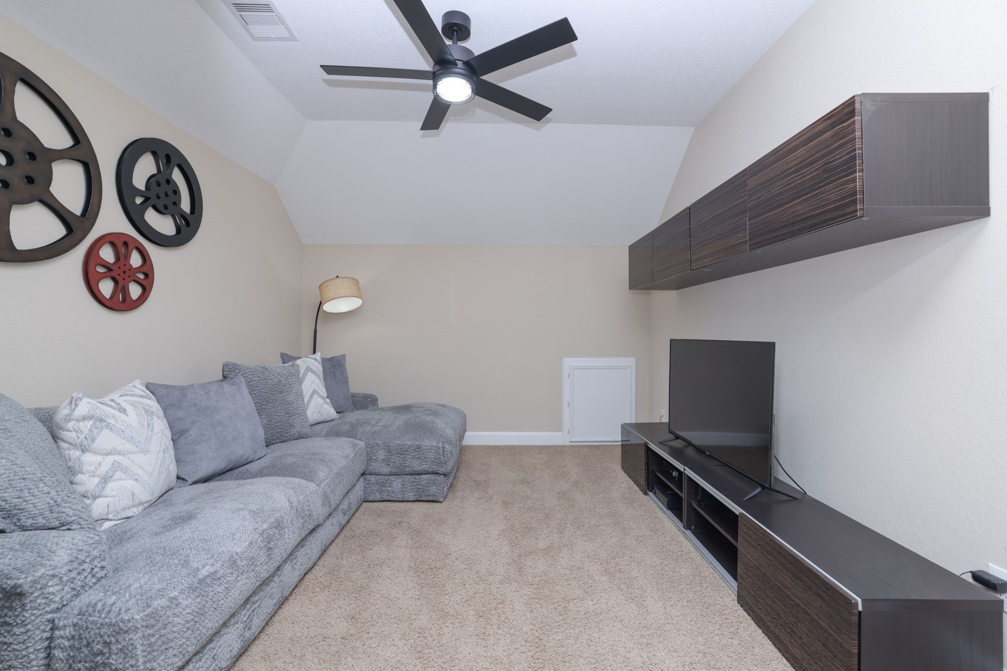 5922 Glen Lief Court Spring, TX 77379 - Photo 29 of 41 a living room with furniture and a flat screen tv