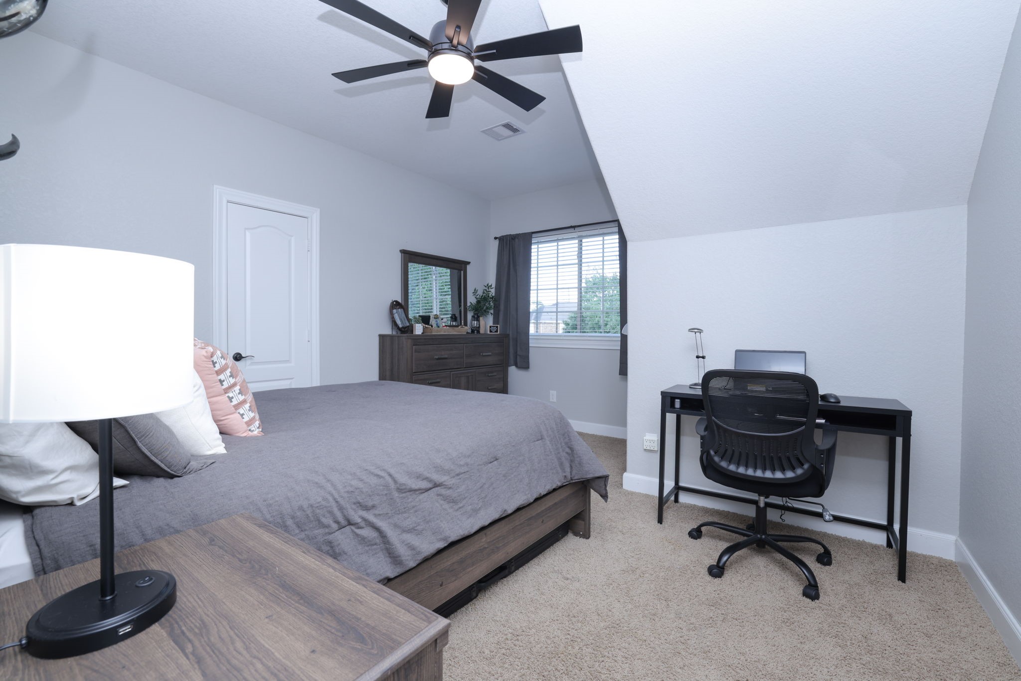 5922 Glen Lief Court Spring, TX 77379 - Photo 30 of 41 a bedroom with furniture and a window