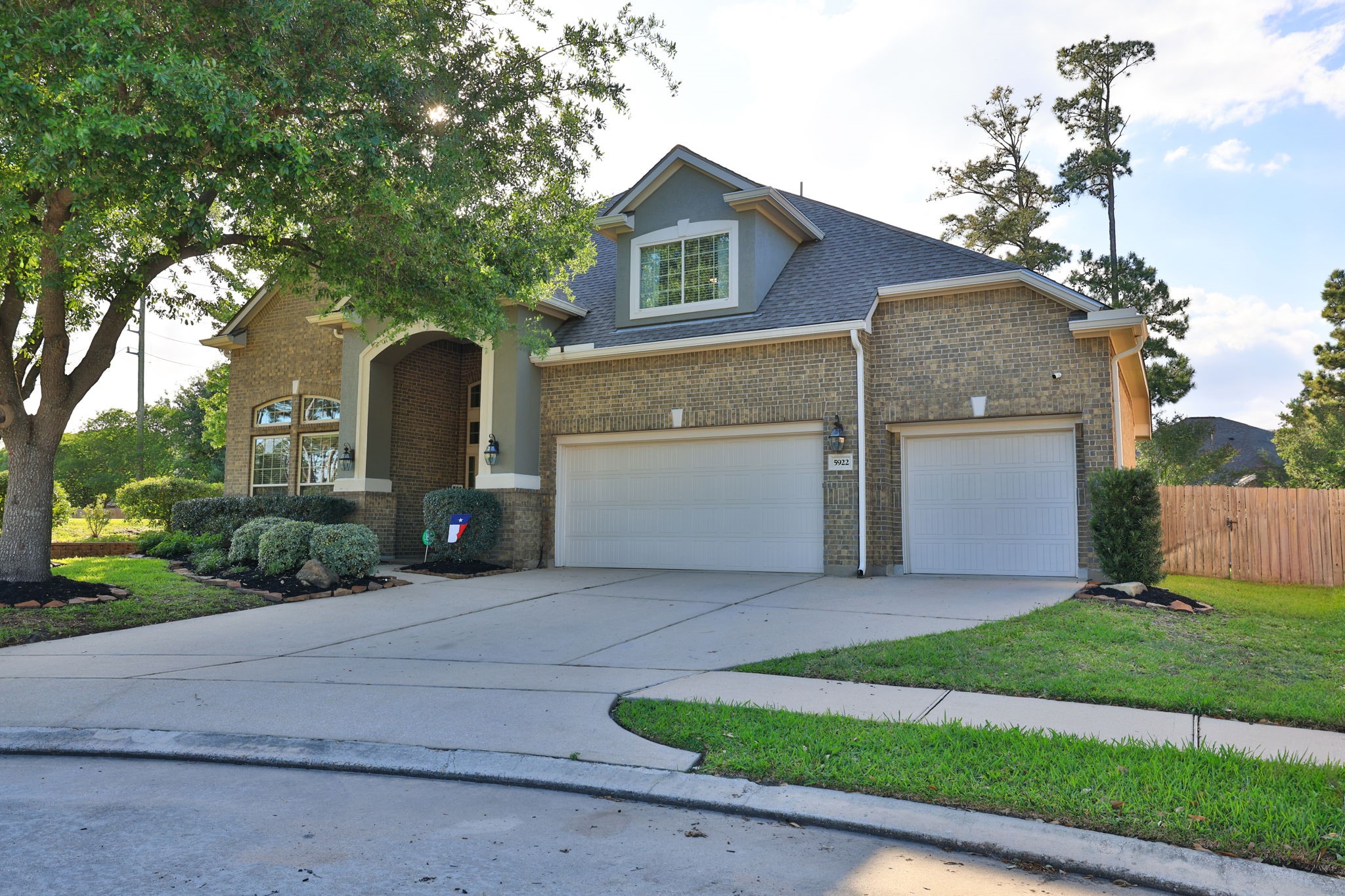 5922 Glen Lief Court Spring, TX 77379 - Photo 3 of 41 a front view of a house with a yard and garage