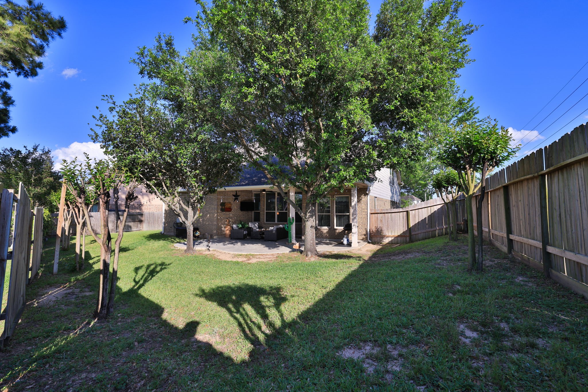 5922 Glen Lief Court Spring, TX 77379 - Photo 40 of 41 a view of a backyard with table and chairs and a fire pit