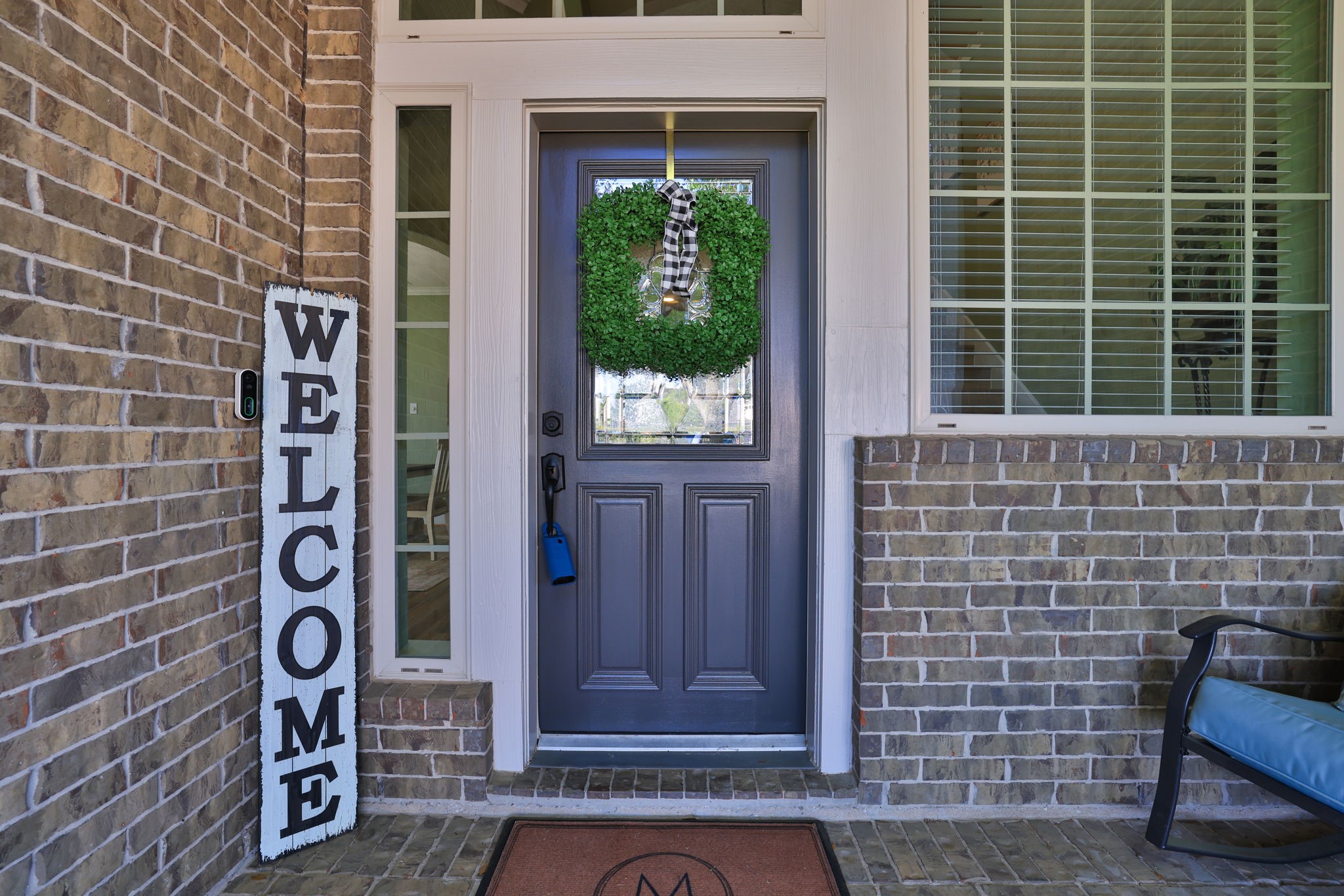5922 Glen Lief Court Spring, TX 77379 - Photo 4 of 41 a brick building with a bench and a potted plant