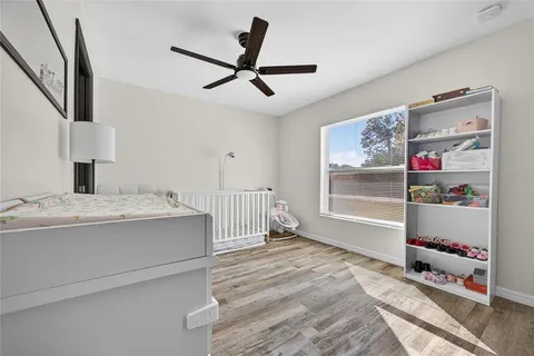 a view of kitchen with furniture and a ceiling fan