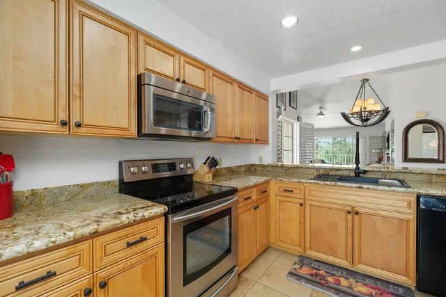 a view of a kitchen sink and fireplace