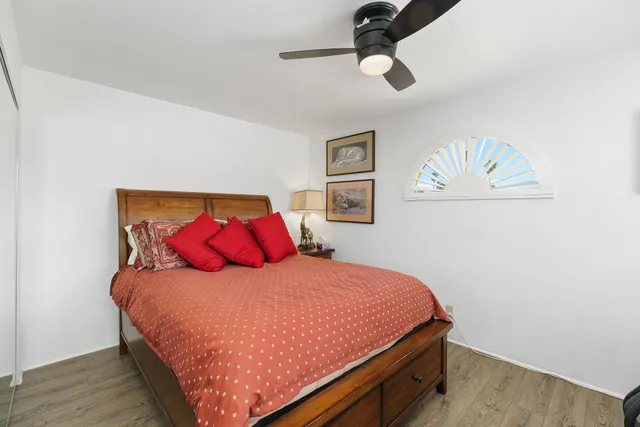 a bathroom with a sink toilet vanity and shower