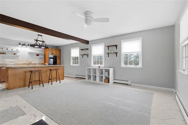 a view of a livingroom with furniture and windows
