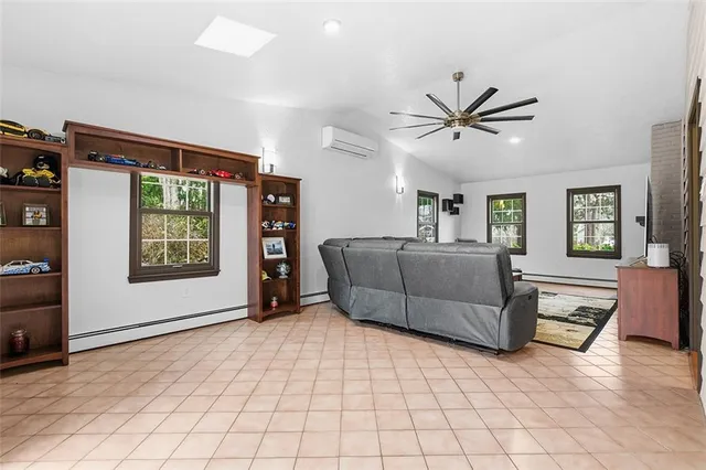 a living room with furniture and window