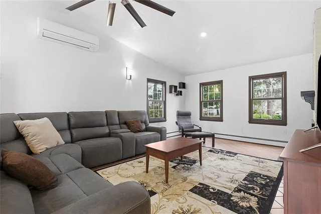 a living room with furniture and a window