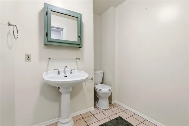 a bathroom with a sink and mirror