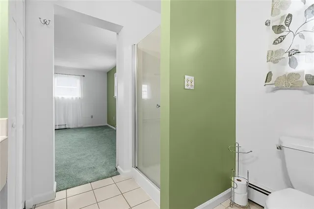 a bathroom with a granite countertop window