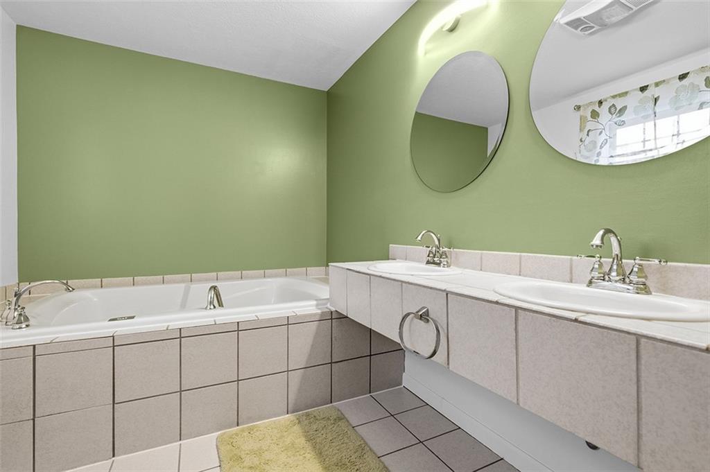 2034 Ewings Mill Road Coraopolis, PA 15108 - Photo 26 of 48 a bathroom with a sink and a mirror