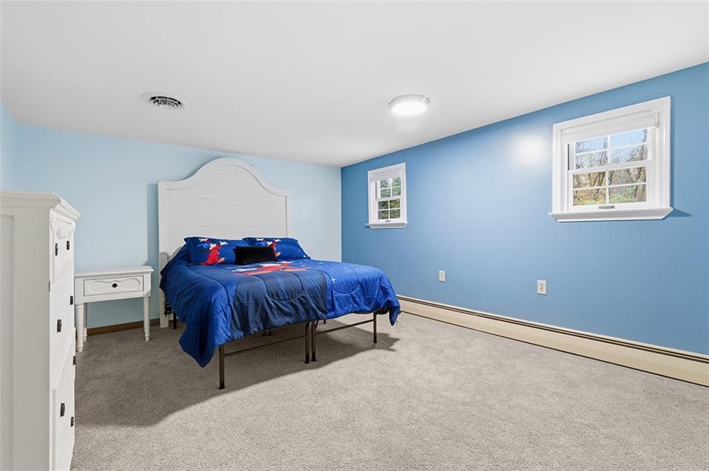 2034 Ewings Mill Road Coraopolis, PA 15108 - Photo 27 of 48 a spacious bedroom with a bed and a cabinets