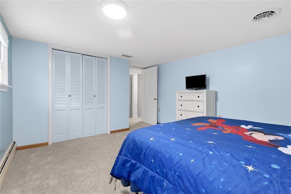 2034 Ewings Mill Road Coraopolis, PA 15108 - Photo 28 of 48 a bedroom with a bed and a flat screen tv