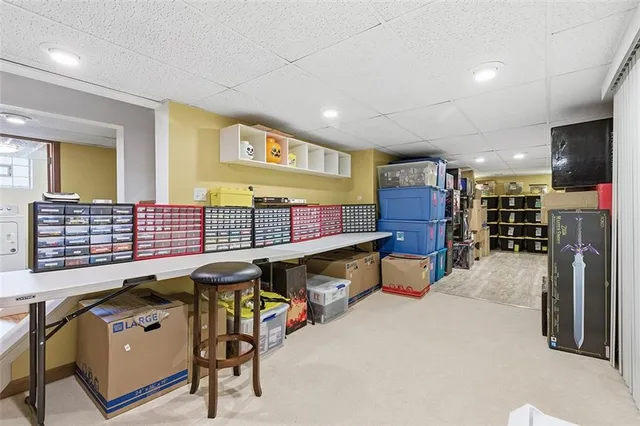 a room with lots of furniture and air hockey table