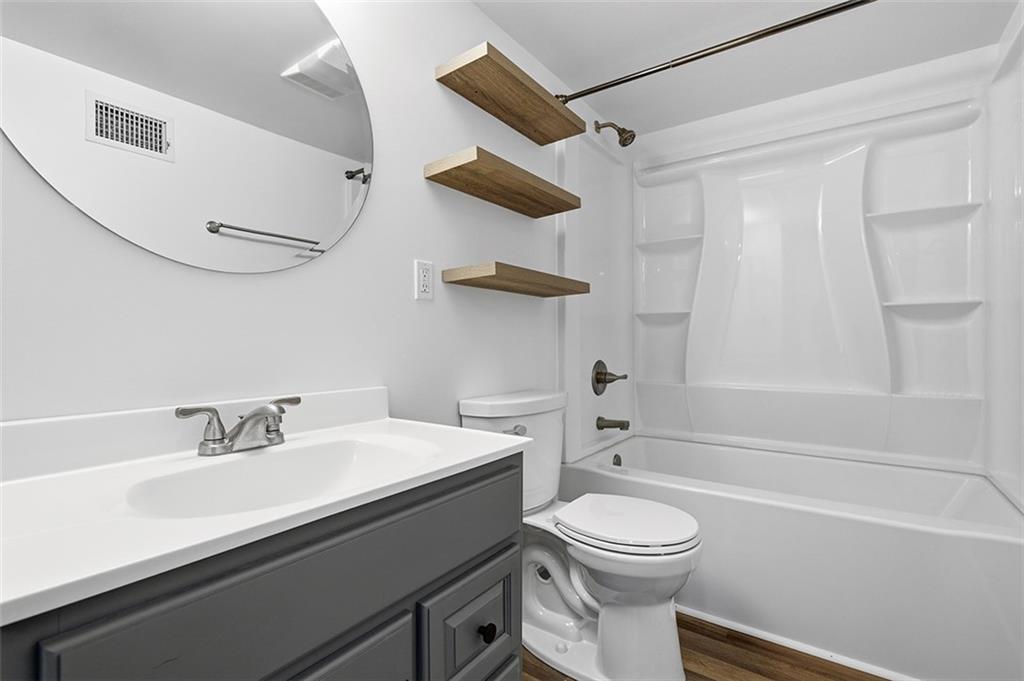 2034 Ewings Mill Road Coraopolis, PA 15108 - Photo 40 of 48 a bathroom with a sink a toilet and a bathtub