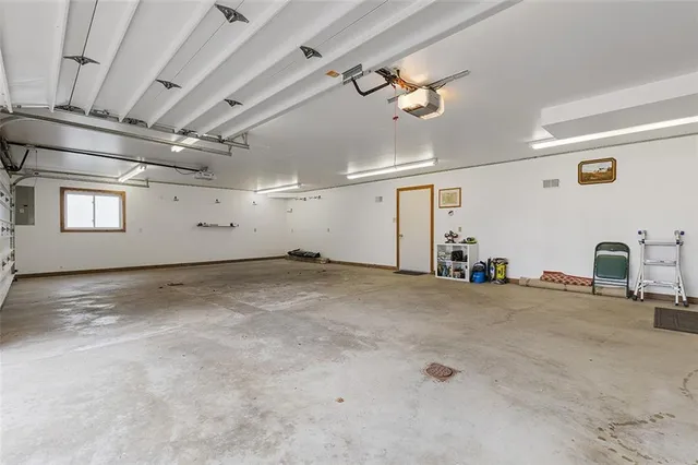 a view of a livingroom with a fireplace and a window