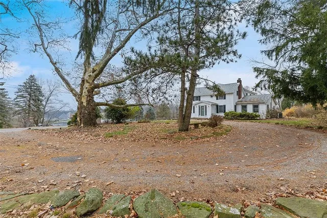 a house with a tree in front of it