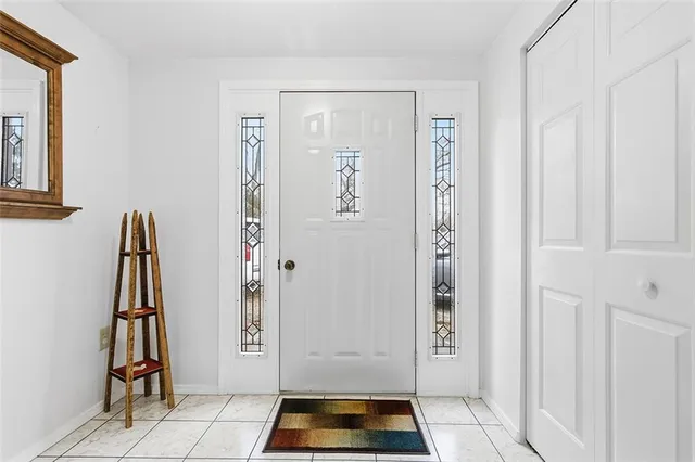 a view of front door with wooden floor