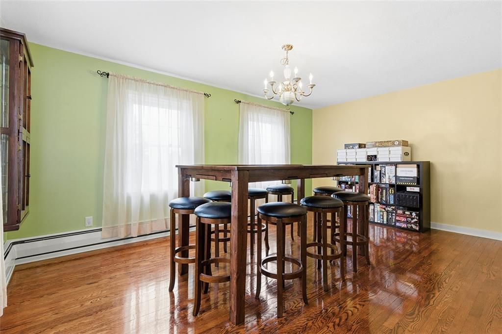 2034 Ewings Mill Road Coraopolis, PA 15108 - Photo 6 of 48 a view of a a dining room with furniture window and wooden floor