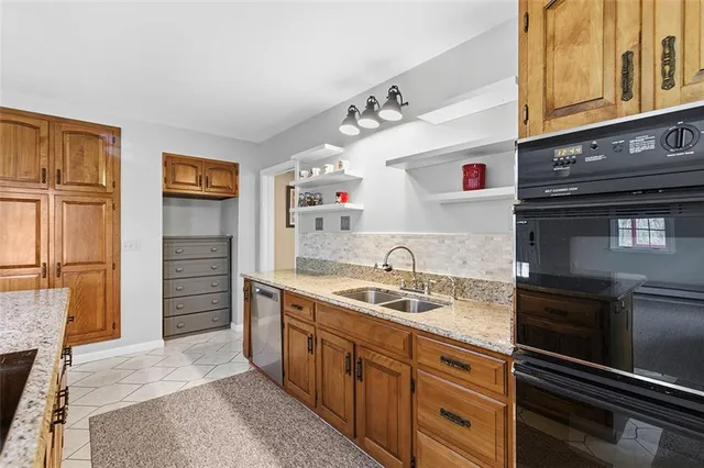 a kitchen with a sink stove and refrigerator