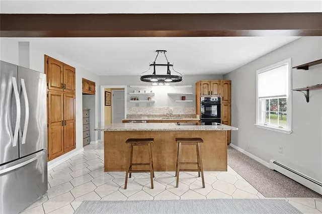 a kitchen with stainless steel appliances a sink and cabinets