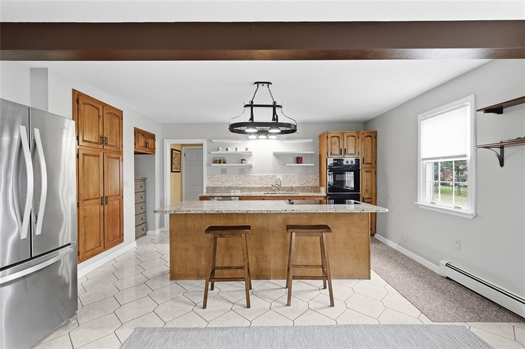 2034 Ewings Mill Road Coraopolis, PA 15108 - Photo 8 of 48 a kitchen with stainless steel appliances a sink and cabinets