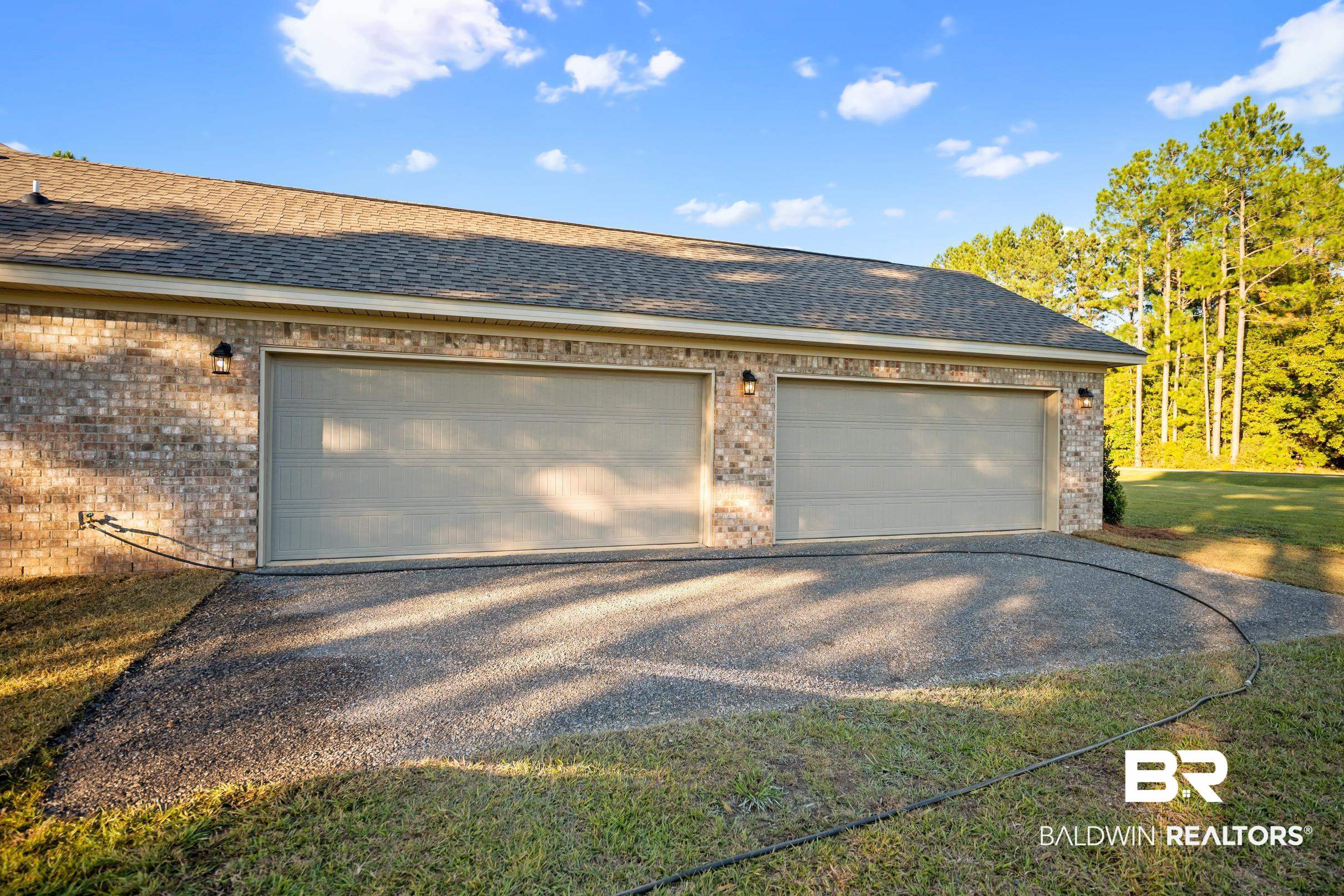 12833 Ward Road West Stapleton, AL 36578 - Photo 23 of 27 Garage featuring gravel driveway