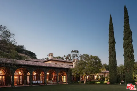 a view of a building with large trees