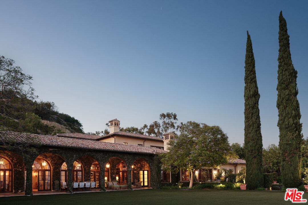 10939 Chalon Road Los Angeles, CA 90077 - Photo 19 of 24 a view of a building with large trees