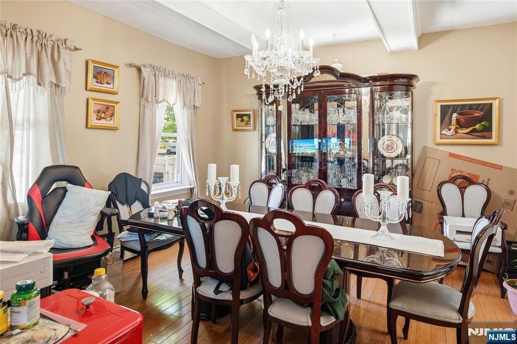 33-35 Pulaski Place Hackensack, NJ 07601 - Photo 23 of 32 a view of a dining room with furniture and chandelier