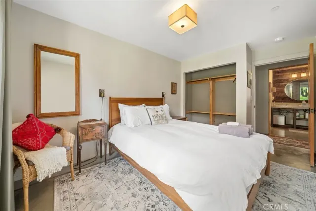 a bedroom with a bed and a cabinets