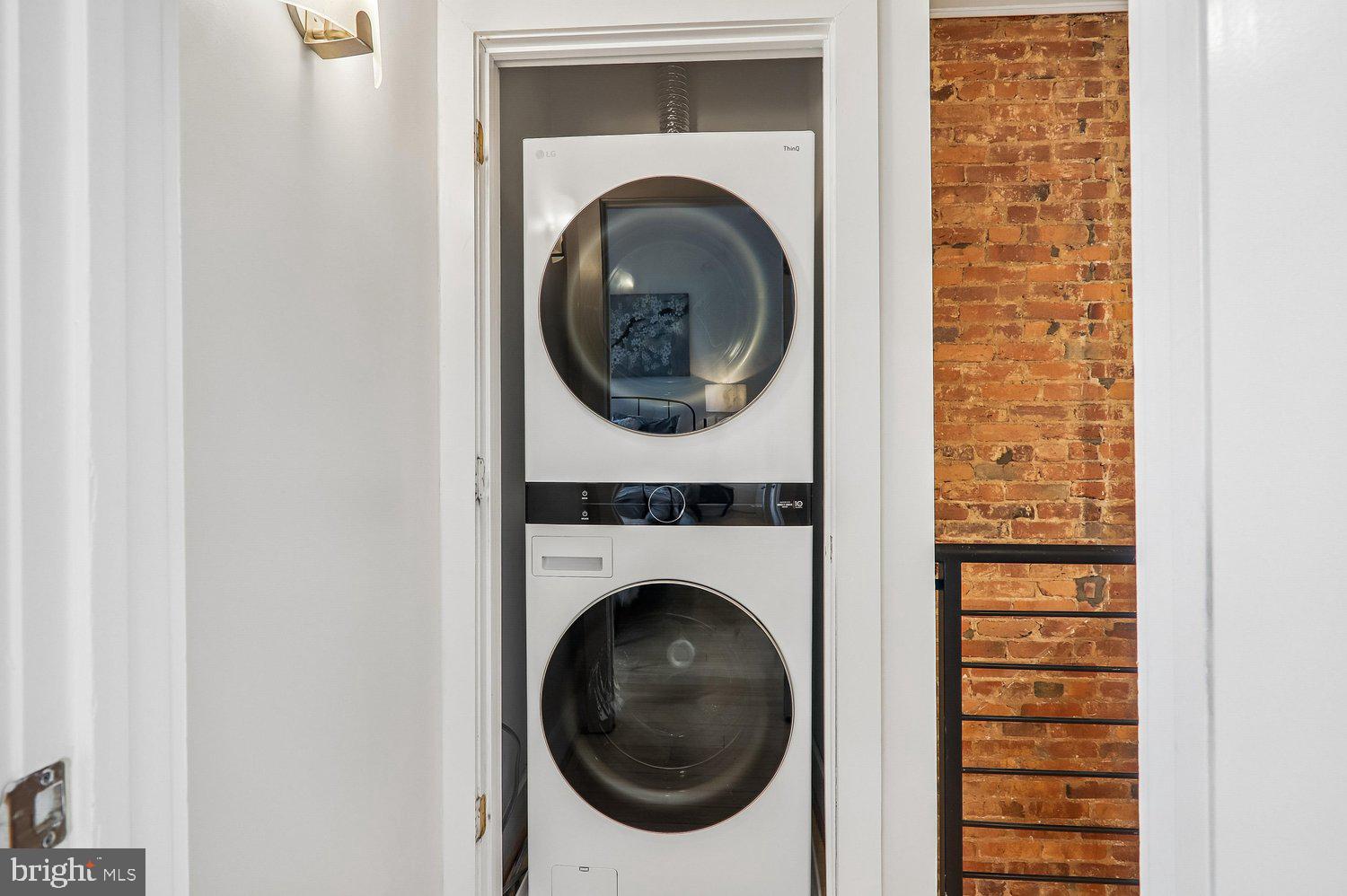 911 L Street Northeast Washington, DC 20002 - Photo 26 of 48 a utility room with dryer and washer