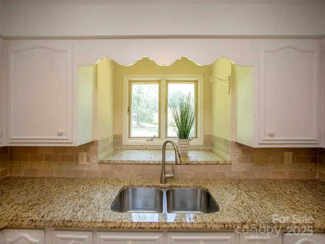 a kitchen with a sink and a window