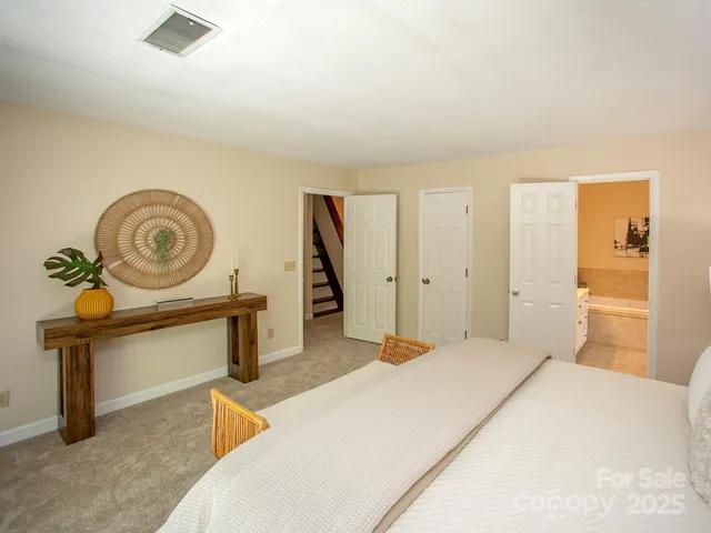 a bedroom with a bed and a cabinets