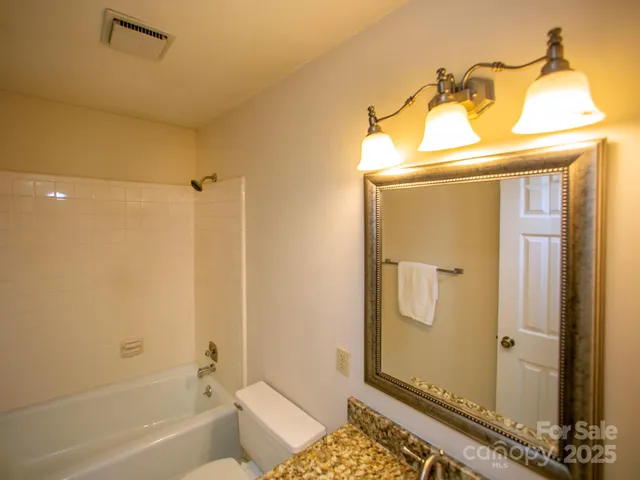 a bathroom with a tub and a shower